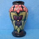 A Moorcroft Vase in the Violet Design by Sally Tuffin.
