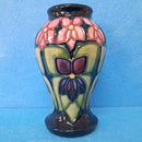 A Moorcroft Vase in the Violet Design by Sally Tuffin.