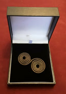 A Bronze Age Spiral Spectacle Cloak Brooch.