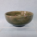 A Moorcroft Small Footed Bowl in the Columbine Design by Walter Moorcroft.