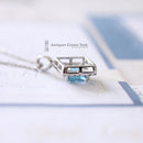 18ct White Gold Blue Topaz & Diamond Pendant