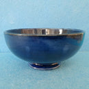 A Moorcroft Footed Bowl in the Orchid Design by Walter Moorcroft