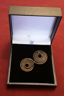 A Bronze Age Spiral Spectacle Cloak Brooch.