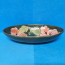 A Moorcroft Oval Bowl in the Coral Hibiscus Design by Walter Moorcroft