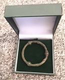 An Anglo Saxon Bronze Annular Cloak Brooch.