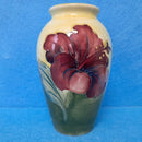 A Moorcroft Vase in the Hibiscus Design by Walter Moorcroft
