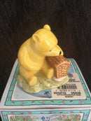 Royal Doulton - Winnie The Pooh figurine Royal Doulton Winnie The Pooh and the far sized basket WP19