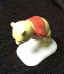 Royal Doulton Winnie The Pooh figurine. Royal Doulton Winnie The Pooh and the paw marks 70th WP3