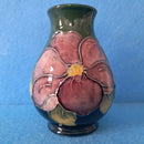 A Moorcroft Vase in the Clematis Pattern by Walter Moorcroft.
