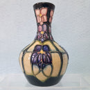 A Small Moorcroft Vase in the Violet Design by Sally Tuffin