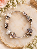 Links of London 925 Sterling Silver Charm Bracelet with Nine Charms – 45g