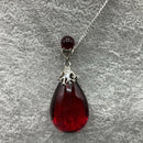 Silver and red amber pendant