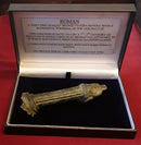 A Roman Bronze Patera Handle Showing The Head Of God Bacchus.