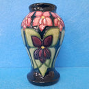 A Moorcroft Vase in the Violet Design by Sally Tuffin.