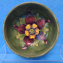 A Moorcroft Small Footed Bowl in the Columbine Design by Walter Moorcroft.