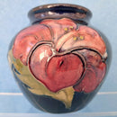 A Moorcroft Vase in the Hibiscus Design. Royal Appointment Label.