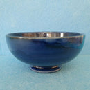 A Moorcroft Footed Bowl in the Orchid Design by Walter Moorcroft