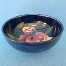 A Moorcroft Footed Bowl in the Orchid Design by Walter Moorcroft