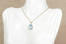 9ct Gold London Blue Topaz & Diamond Pendant and Gold Chain.