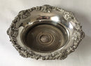 Victorian pair of silver plated bottle coasters with applied rims of trailing vines.