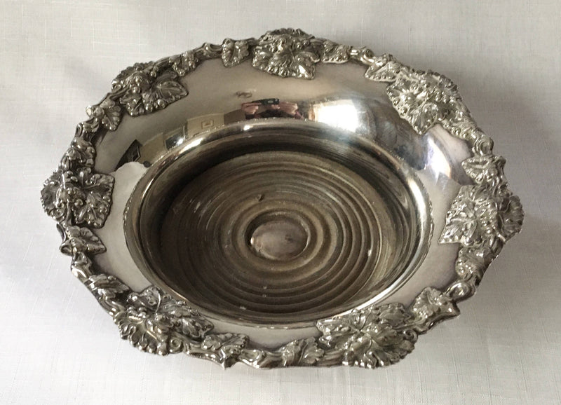 Victorian pair of silver plated bottle coasters with applied rims of trailing vines.