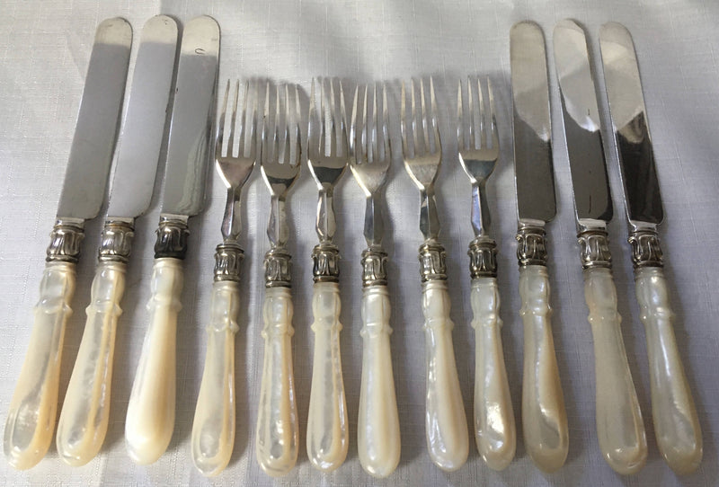 Victorian cased set of crested silver plate and mother of pearl dessert cutlery for twelve. Elkington 1880 and 1881.