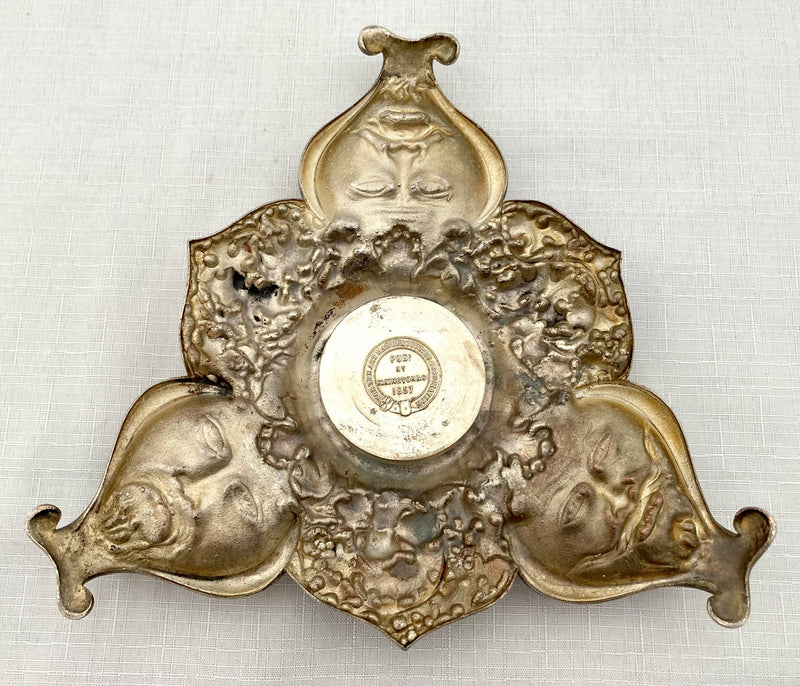 Victorian silver plated inkstand of trefoil form adorned with facial profiles. Elkington 1857 for The Art Manufacturers Association.