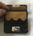 Victorian silver mounted black leather purse. London 1899 Thomas De La Rue & Co.