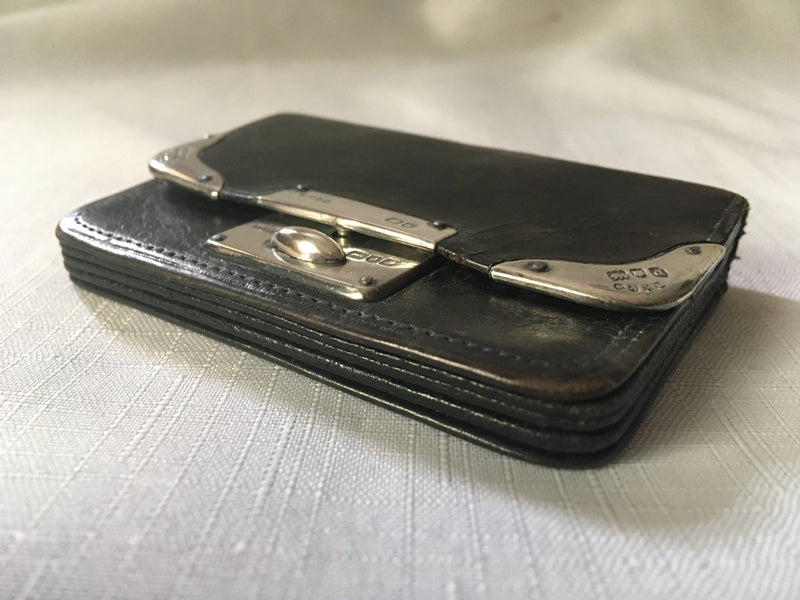 Victorian silver mounted black leather purse. London 1899 Thomas De La Rue & Co.