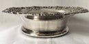 Victorian pair of silver plated bottle coasters with applied rims of trailing vines.