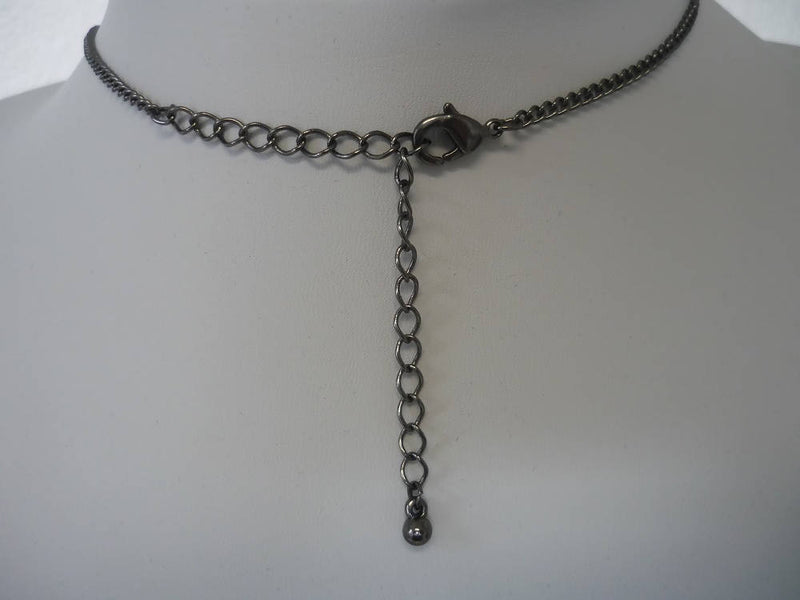 A Vintage Style Necklace with Oval and Round stones in a Circular Setting.
