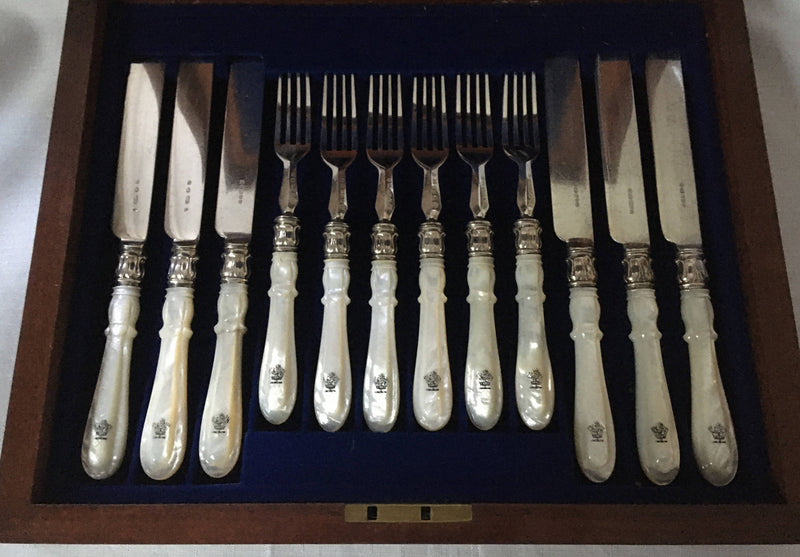 Victorian cased set of crested silver plate and mother of pearl dessert cutlery for twelve. Elkington 1880 and 1881.