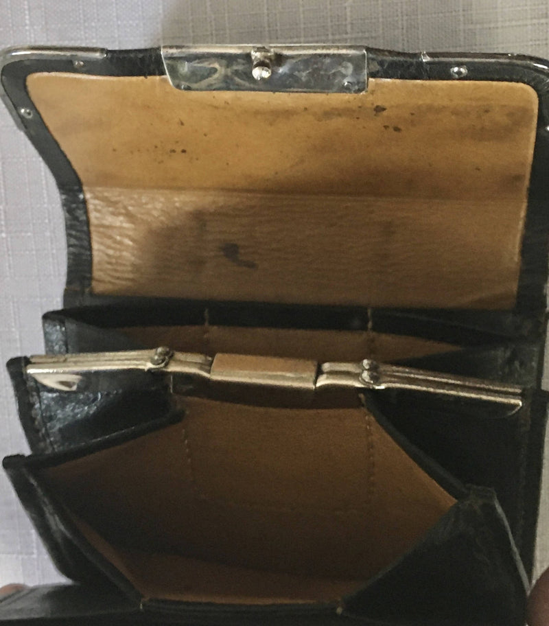 Victorian silver mounted black leather purse. London 1899 Thomas De La Rue & Co.