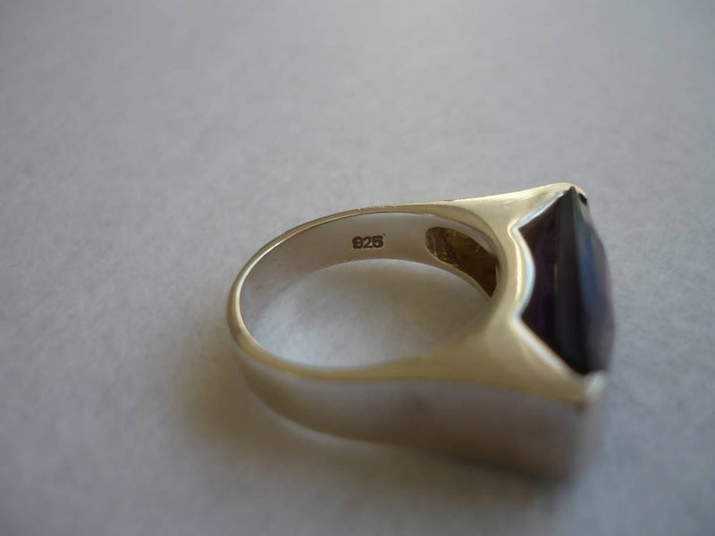 A Silver Ring With an Amethyst Colour Stone