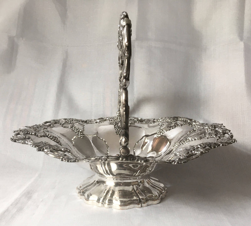 A striking late Georgian Old Sheffield Plate basket with applied fruiting vine decoration, circa 1830.