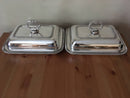 Pair of late Georgian Old Sheffield Plate crested entree dishes with covers and detachable handles.