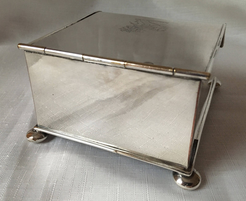 Georgian, Sheffield Plated crested inkstand raised on four bun feet. Circa 1820 - 1830.