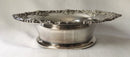 Victorian pair of silver plated bottle coasters with applied rims of trailing vines.