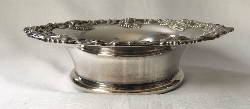 Victorian pair of silver plated bottle coasters with applied rims of trailing vines.