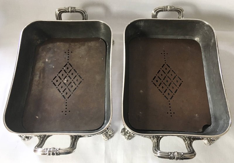 Late Georgian pair of Old Sheffield Plated, crested, entree dishes and covers on warming stands. Circa 1820.