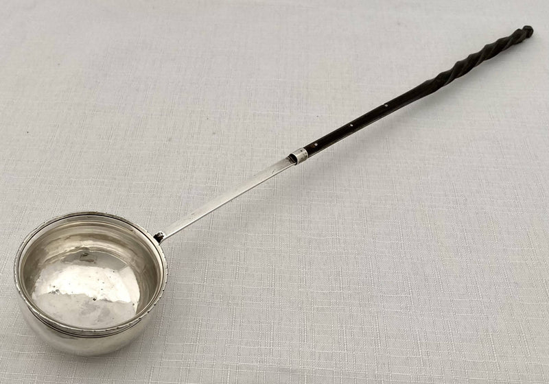 Georgian, George III period, white metal toddy ladle, circa 1810.