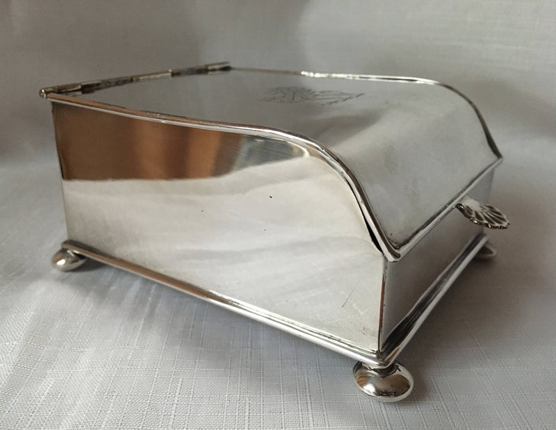 Georgian, Sheffield Plated crested inkstand raised on four bun feet. Circa 1820 - 1830.