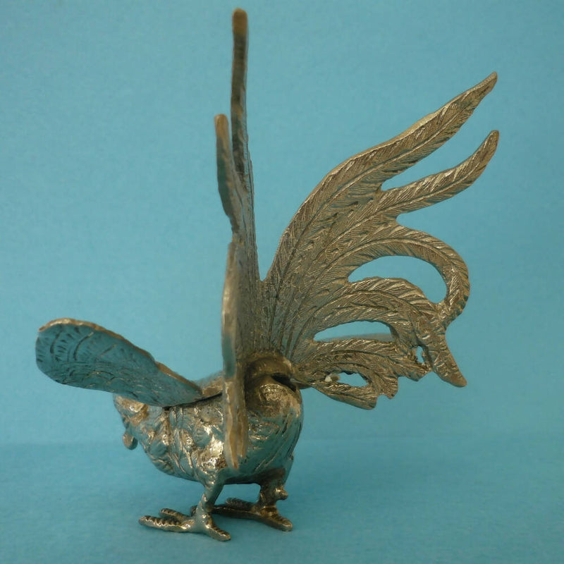 A White Metal Figure of a Cock or Rooster