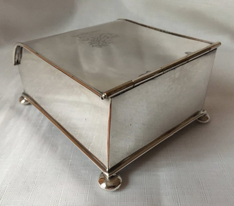 Georgian, Sheffield Plated crested inkstand raised on four bun feet. Circa 1820 - 1830.