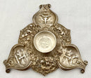 Victorian silver plated inkstand of trefoil form adorned with facial profiles. Elkington 1857 for The Art Manufacturers Association.