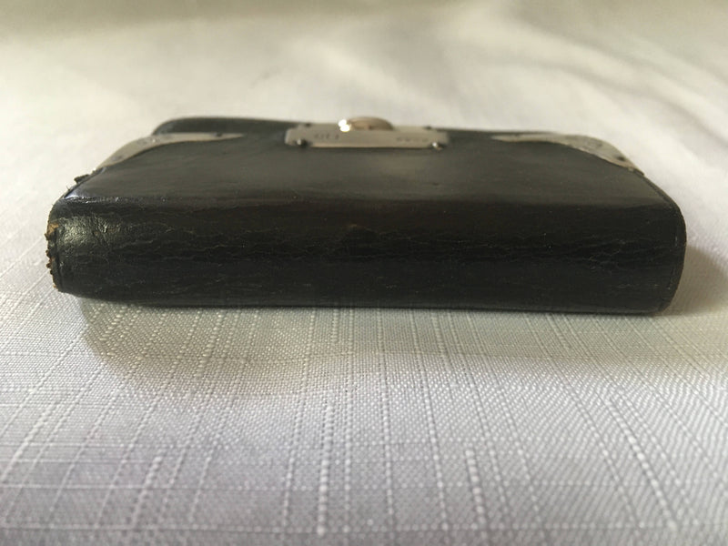 Victorian silver mounted black leather purse. London 1899 Thomas De La Rue & Co.