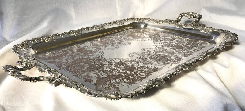 A 19th century ornate Sheffield Plated twin handled serving tray.
