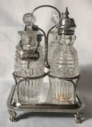 Georgian, George III, silver cruet stand with later silver mounted cut glass bottles. Circa 1784 - 1821. 4.9 troy ounces.