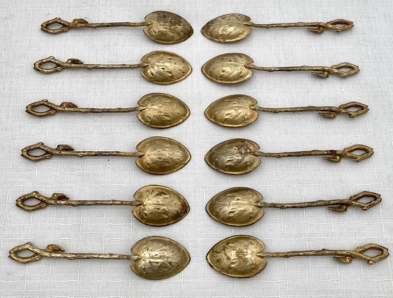 Victorian Cased Set of Twelve Naturalistic Leaf & Vine Form Gilt Metal Teaspoons, circa 1870 - 1890.