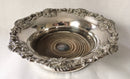 Victorian pair of silver plated bottle coasters with applied rims of trailing vines.